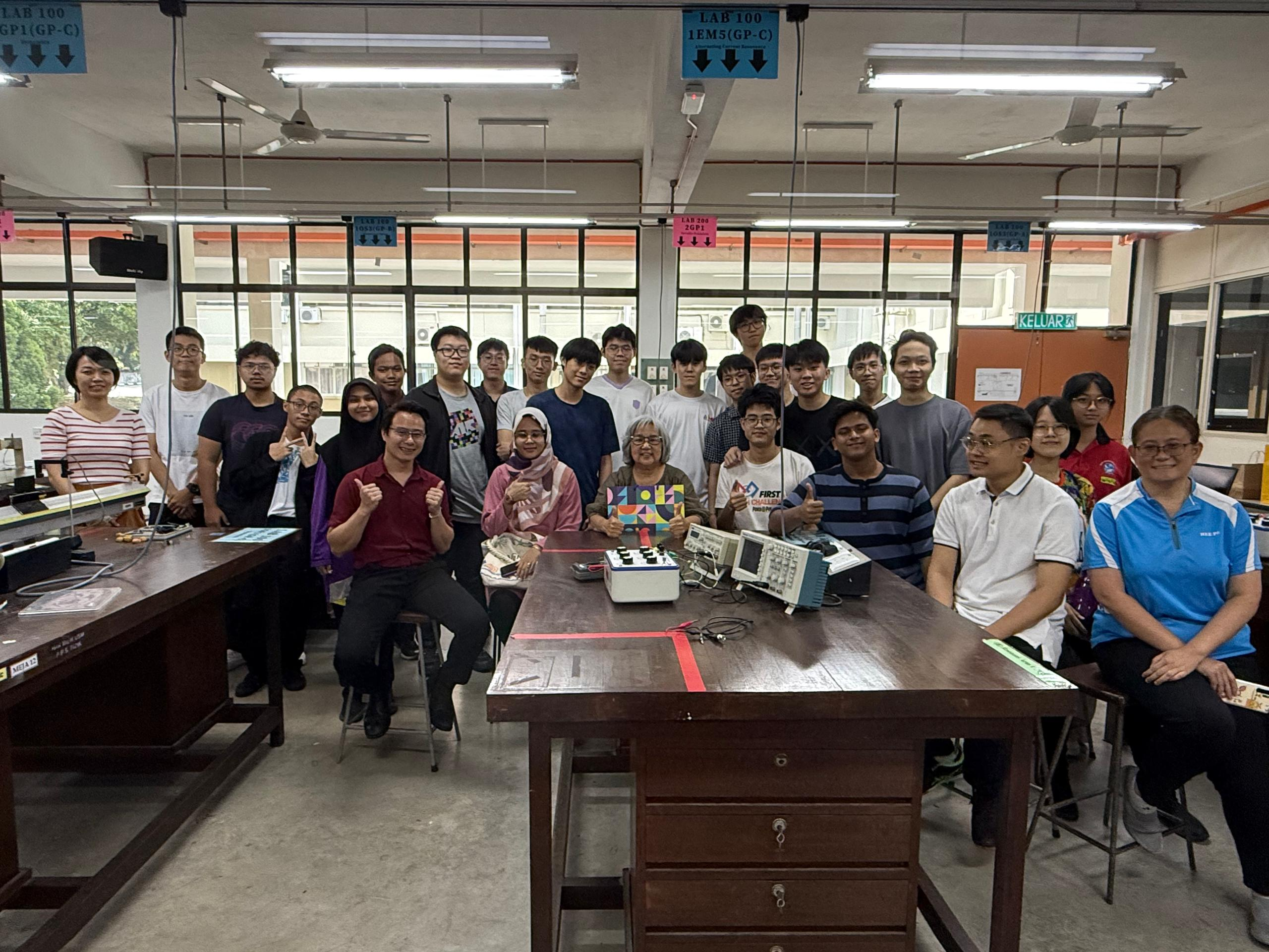 Olympiad students and mentors in a physics laboratory